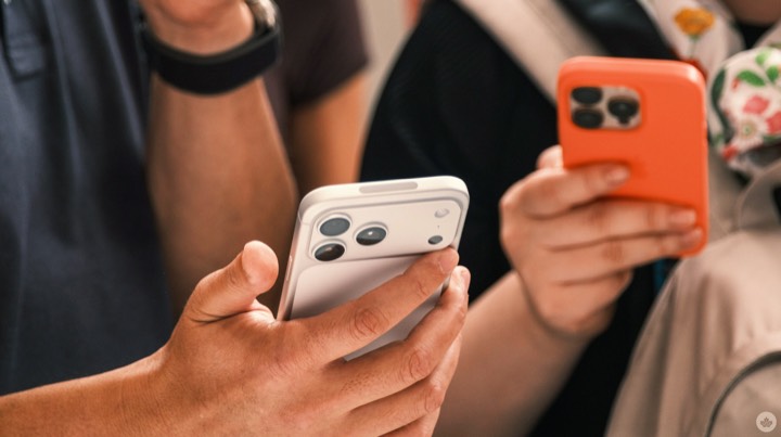 Two people holding phones