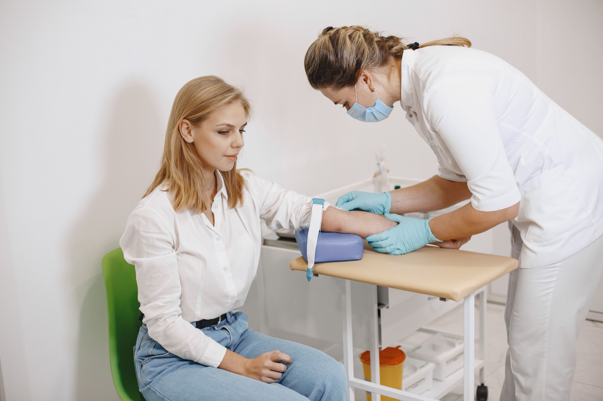 A clinician reviewing lab trend lines with a long-term patient